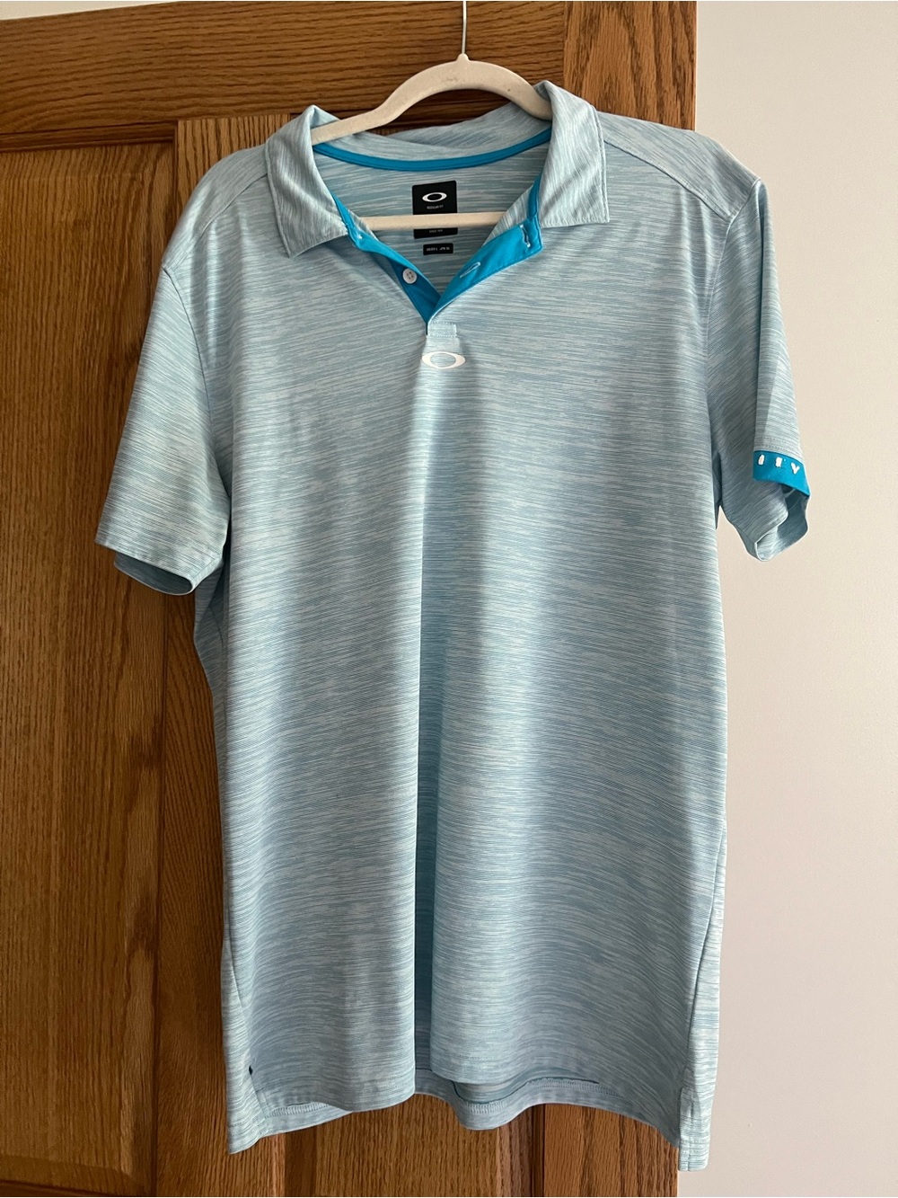 Oakley Men’s Heather Light Blue Polo with Teal Trim